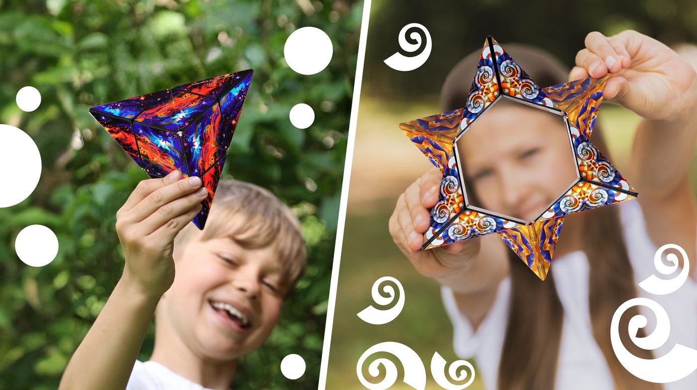 A boy and a girl each holding a Shashibo folded into a star