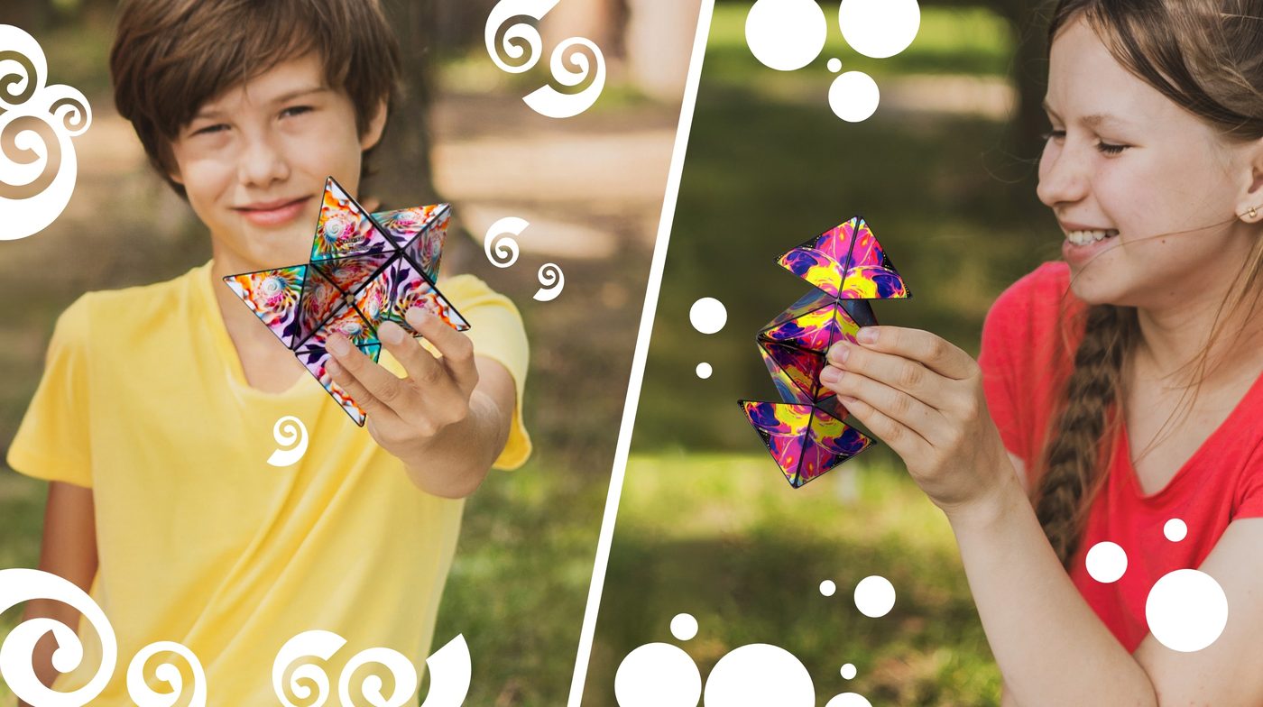 Children holding up Shashibo cubes folded into star shapes